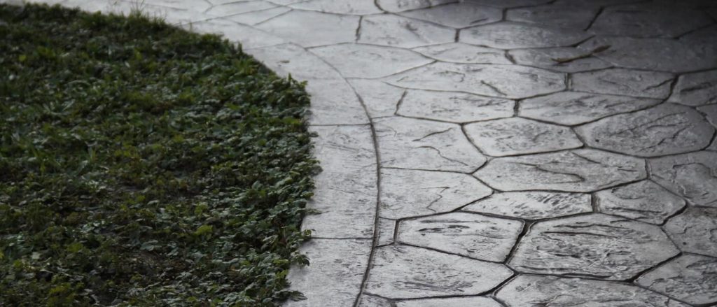 Stamped Concrete with Edge to Grass Transition Design